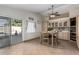 Kitchen with breakfast nook, view of backyard pool, and lots of natural light at 12742 W Ash St, El Mirage, AZ 85335