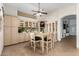 Eat-in kitchen with light wood cabinets and a breakfast table at 12742 W Ash St, El Mirage, AZ 85335