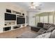 Spacious living room featuring built-in entertainment center and comfortable seating at 12742 W Ash St, El Mirage, AZ 85335