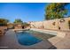 Refreshing pool with a large patio and outdoor kitchen at 12742 W Ash St, El Mirage, AZ 85335