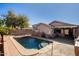 Spacious backyard with a sparkling pool and patio area at 12742 W Ash St, El Mirage, AZ 85335