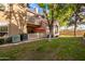 Building exterior showcasing a patio, lawn, and trees at 1633 E Lakeside Dr # 77, Gilbert, AZ 85234