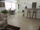 Kitchen with a breakfast bar, white cabinets and tile floors at 1881 E Kerby Farms Rd, Chandler, AZ 85249