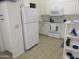 Clean and efficient kitchen with white cabinets and appliances at 1881 E Kerby Farms Rd, Chandler, AZ 85249