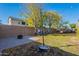 Large backyard with playset, firepit, and grassy area at 23096 S 223Rd Way, Queen Creek, AZ 85142