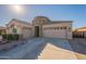 Tan-colored house with a two-car garage at 23096 S 223Rd Way, Queen Creek, AZ 85142