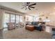 Bright living room with open floor plan, featuring comfortable seating and access to the kitchen at 23096 S 223Rd Way, Queen Creek, AZ 85142