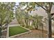 Private backyard with artificial turf and desert landscaping at 2315 E Pinchot Ave # 105, Phoenix, AZ 85016