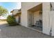 Neat front porch with sitting area and hanging planter at 252 E Betty Elyse Ln, Phoenix, AZ 85022