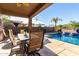 Inviting pool area with patio furniture and a covered dining area at 25642 N Fernbush Dr, Phoenix, AZ 85083