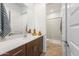 Clean bathroom with single vanity and a walk-in shower at 25921 N 76Th Ave, Peoria, AZ 85383