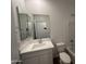 Clean bathroom with single vanity and a bathtub at 27036 N 168Th Ln, Surprise, AZ 85387