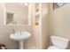 Small bathroom with pedestal sink and toilet at 3131 E Legacy Dr # 1044, Phoenix, AZ 85042