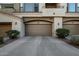 Two-car attached garage with tan doors at 3131 E Legacy Dr # 1044, Phoenix, AZ 85042