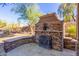 Stone outdoor fireplace perfect for cozy evenings at 31521 N 48Th St, Cave Creek, AZ 85331