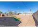 Large backyard with gravel and a dog house at 322 W Dr Martin Luther King St, Eloy, AZ 85131