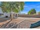 Backyard with tree, gravel, and a green slide at 38290 N Sandy Dr, San Tan Valley, AZ 85140