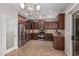 Modern kitchen with dark wood cabinets and stainless steel appliances at 398 W Lyle Ave, San Tan Valley, AZ 85140