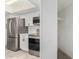 Modern kitchen features stainless steel appliances and white cabinetry at 4116 W Calavar Rd, Phoenix, AZ 85053