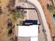 Aerial view of a house with a flat roof and a gravel yard at 44635 San Domingo Peak Trl, Morristown, AZ 85342