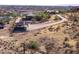 Aerial view of a house and property with a covered structure at 44635 San Domingo Peak Trl, Morristown, AZ 85342