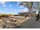 Desert landscape with firepit and pathway at 44635 San Domingo Peak Trl, Morristown, AZ 85342