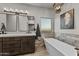 Elegant bathroom with double vanity and free-standing tub at 44635 San Domingo Peak Trl, Morristown, AZ 85342