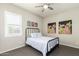 Cozy bedroom with metal bed frame and wall art at 4506 S Eastern Run, Mesa, AZ 85212