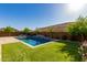 Luxury backyard with a sparkling pool and lush landscaping at 4506 S Eastern Run, Mesa, AZ 85212