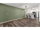 Dining area with wood-look flooring and green accent wall at 4798 E Kiva St, Phoenix, AZ 85044