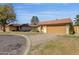 Tan stucco house with a tile roof, and a two-car garage at 4798 E Kiva St, Phoenix, AZ 85044