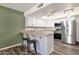 Kitchen with white cabinets, stainless steel appliances, and an island at 4798 E Kiva St, Phoenix, AZ 85044