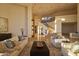 Elegant living room with high ceilings, a grand staircase, and ample natural light at 6020 E Indian Bend Rd, Paradise Valley, AZ 85253