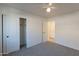 Bedroom with ceiling fan, carpet flooring, and double door closet at 604 S 13Th Pl, Coolidge, AZ 85128