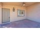 Covered front patio with a door and window at 604 S 13Th Pl, Coolidge, AZ 85128