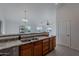 Kitchen with a breakfast bar and view of the living room at 604 S 13Th Pl, Coolidge, AZ 85128