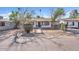 Front view of a charming white house with a fenced yard at 6107 W Orangewood Ave, Glendale, AZ 85301