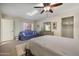 Bright bedroom with a cozy sitting area and ample closet space at 6164 E Minton Pl, Mesa, AZ 85215