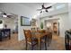 Spacious dining area with a wooden table and seating for six at 6164 E Minton Pl, Mesa, AZ 85215