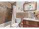 Clean bathroom with tub, shower, vanity, and updated fixtures at 6428 W Townley Ave, Glendale, AZ 85302