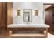 Elegant bathroom with a double vanity, marble countertop, and modern fixtures at 6541 N 48Th St, Paradise Valley, AZ 85253