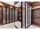 Spacious walk-in closet, custom built-ins, and glass-front cabinets at 6541 N 48Th St, Paradise Valley, AZ 85253