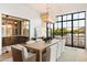 Elegant dining room with large windows, a statement chandelier and mountain views at 6541 N 48Th St, Paradise Valley, AZ 85253