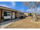 Front view of a brick ranch house with a porch and landscaping at 710 N Poplar St, Gilbert, AZ 85233