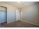 Another bedroom with carpet, closet, and access to a bathroom at 7118 E Arbor Ave, Mesa, AZ 85208