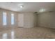 Bright entryway with tile flooring, neutral walls, and a white door at 7118 E Arbor Ave, Mesa, AZ 85208