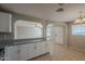 Kitchen with granite countertops and white cabinets at 7118 E Arbor Ave, Mesa, AZ 85208