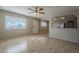 Living room with tile floors and a view into the kitchen at 7118 E Arbor Ave, Mesa, AZ 85208