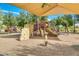 Community playground with shaded play structures at 769 W Holstein Trl, San Tan Valley, AZ 85143