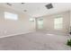 Bright bedroom with carpeted floors and multiple windows providing ample natural light at 10331 W Adam Ave, Peoria, AZ 85382